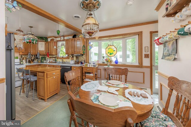 107 Elm Ave, Pitman, NJ 08071 - dining area featuring light wood-type flooring, a chandelier, and crown molding