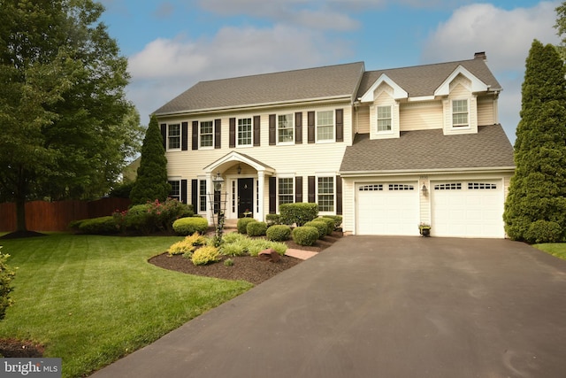 3930 Liz Cir, Doylestown, PA 18902 - colonial house featuring asphalt driveway, roof with shingles, and an attached garage