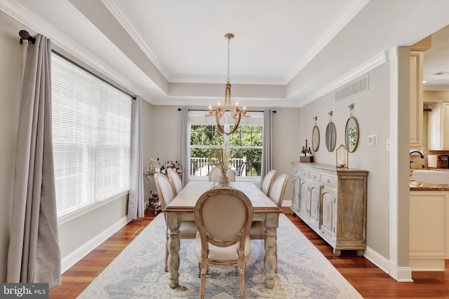 3930 Liz Cir, Doylestown, PA 18902 - dining room with a chandelier, wood finished floors, a raised ceiling, and ornamental molding