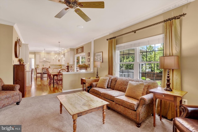 3930 Liz Cir, Doylestown, PA 18902 - living area featuring crown molding, ceiling fan, light carpet, and light wood-type flooring