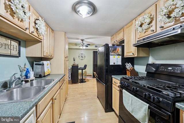 3750 Clarendon Ave Unit 5, Philadelphia, PA 19114 - kitchen with black range with gas cooktop, under cabinet range hood, light brown cabinets, light wood-style floors, and ceiling fan