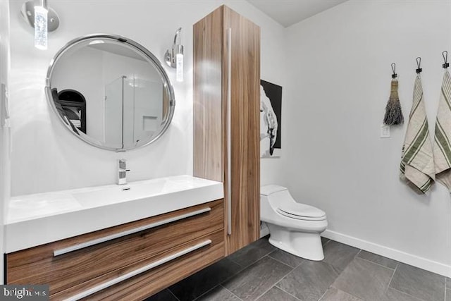 1700 Kalorama Rd NW Unit 310, Washington, DC 20009 - bathroom with vanity, toilet, and baseboards