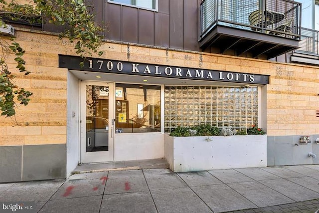1700 Kalorama Rd NW Unit 310, Washington, DC 20009 - doorway to property with board and batten siding and a balcony