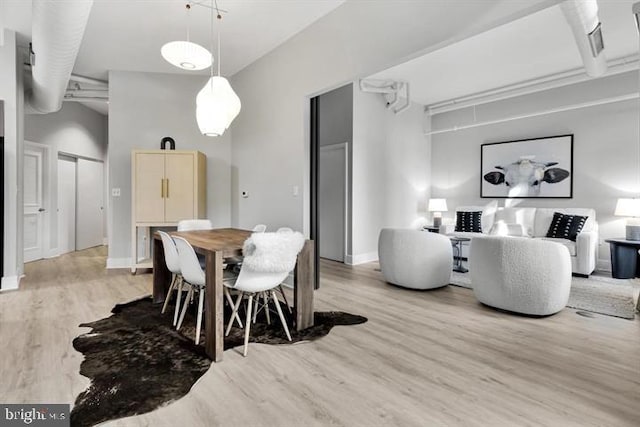 1700 Kalorama Rd NW Unit 310, Washington, DC 20009 - dining space with light wood-style flooring and baseboards