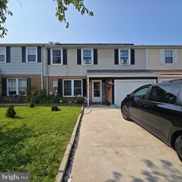 1709 Kingswood Pl, Clementon, NJ 08021 - multi unit property featuring concrete driveway, brick siding, a front lawn, and an attached garage