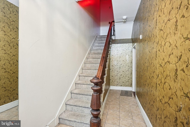 713 Washington St, Easton, PA 18042 - stairway with wallpapered walls and tile patterned flooring