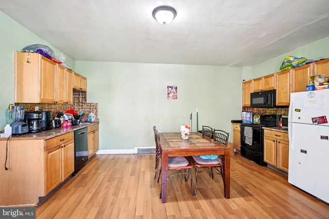 713 Washington St, Easton, PA 18042 - kitchen with black appliances, light wood-style flooring, backsplash, and light brown cabinets
