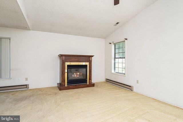 30 Hilltop Ln W, Columbus, NJ 08022 - unfurnished living room featuring a baseboard heating unit, carpet flooring, a glass covered fireplace, and a textured ceiling