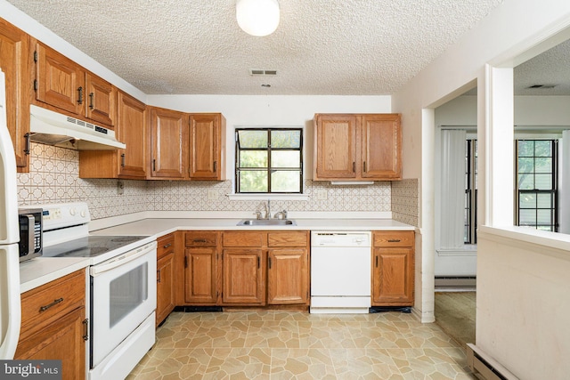 30 Hilltop Ln W, Columbus, NJ 08022 - kitchen featuring white appliances, under cabinet range hood, healthy amount of natural light, light countertops, and a textured ceiling