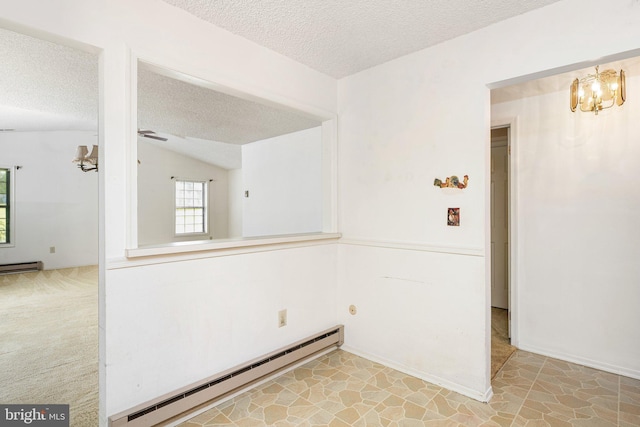 30 Hilltop Ln W, Columbus, NJ 08022 - empty room with a baseboard heating unit, a textured ceiling, a chandelier, vaulted ceiling, and ceiling fan