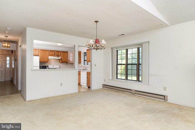 30 Hilltop Ln W, Columbus, NJ 08022 - kitchen featuring a chandelier, baseboard heating, under cabinet range hood, light colored carpet, and a textured ceiling