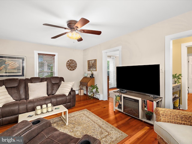 414 S Aurora St, Easton, MD 21601 - living room with healthy amount of natural light, a ceiling fan, and wood finished floors
