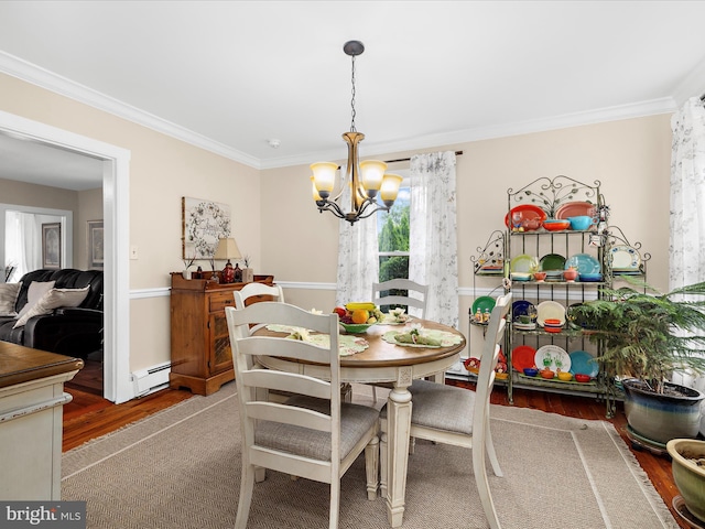 414 S Aurora St, Easton, MD 21601 - dining area featuring baseboard heating, a chandelier, crown molding, and wood finished floors