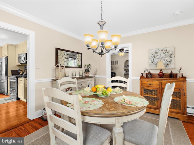414 S Aurora St, Easton, MD 21601 - dining area featuring a chandelier, ornamental molding, wood finished floors, and ceiling fan