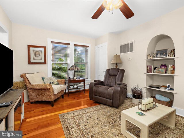 414 S Aurora St, Easton, MD 21601 - living room featuring a ceiling fan and wood finished floors