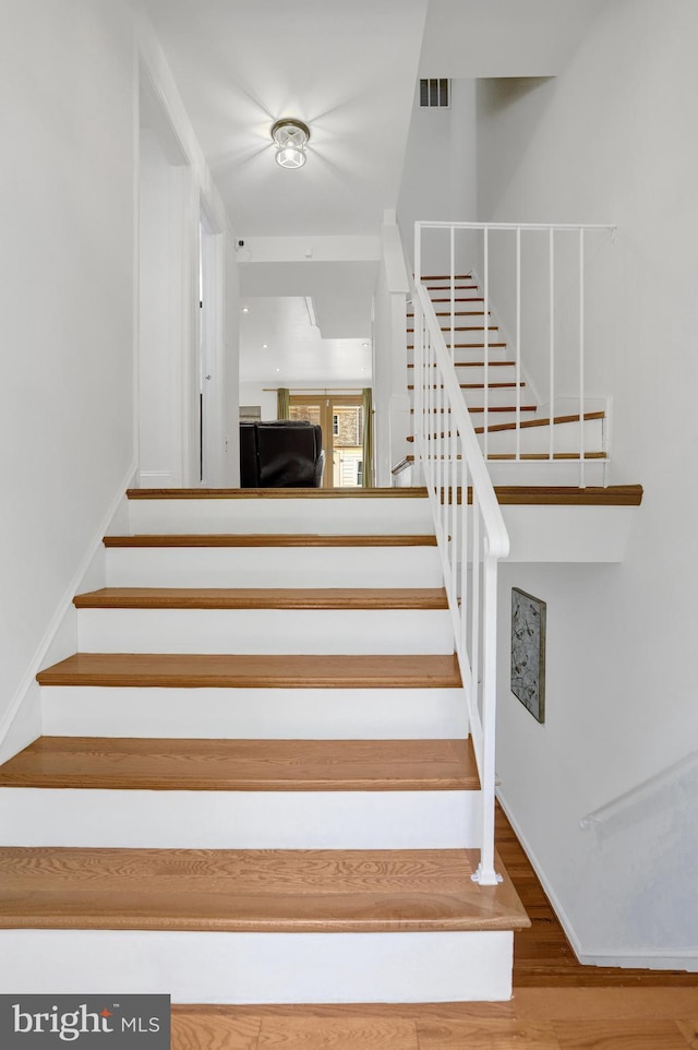 8108 Rhodell Ln, Springfield, VA 22153 - stairs with wood finished floors and baseboards