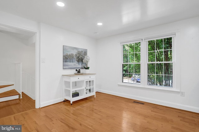 8108 Rhodell Ln, Springfield, VA 22153 - empty room with light wood-style flooring, recessed lighting, and stairs