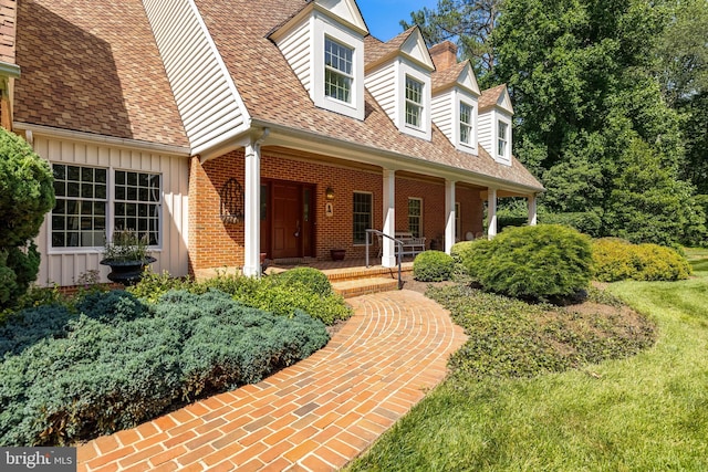 2647 Shepperd Rd, Monkton, MD 21111 - doorway to property featuring board and batten siding, a porch, brick siding, and a shingled roof