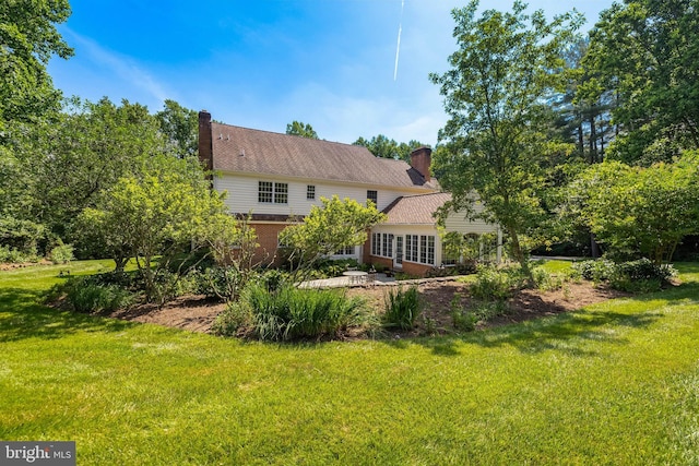 2647 Shepperd Rd, Monkton, MD 21111 - rear view of property with a lawn, a chimney, and brick siding