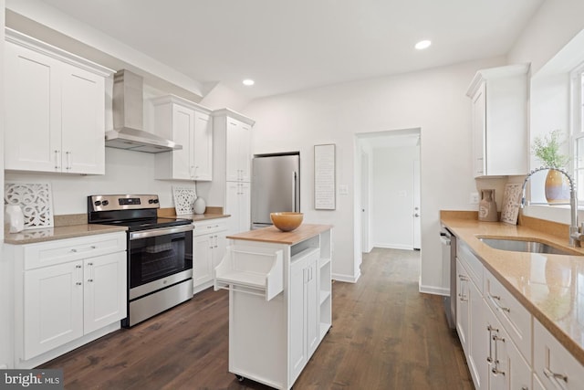 201 Parkway St, Winchester, VA 22601 - kitchen featuring stainless steel appliances, wall chimney range hood, a sink, white cabinetry, and recessed lighting