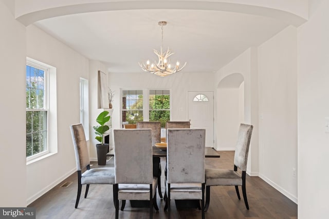 201 Parkway St, Winchester, VA 22601 - dining space featuring healthy amount of natural light, arched walkways, a chandelier, and dark wood finished floors