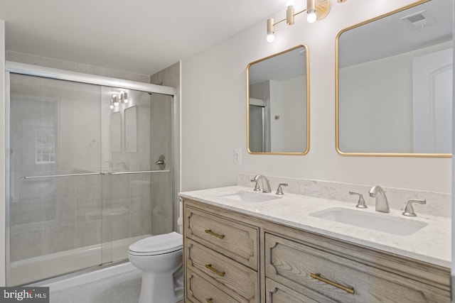 201 Parkway St, Winchester, VA 22601 - full bath featuring double vanity, toilet, a stall shower, and tile patterned floors