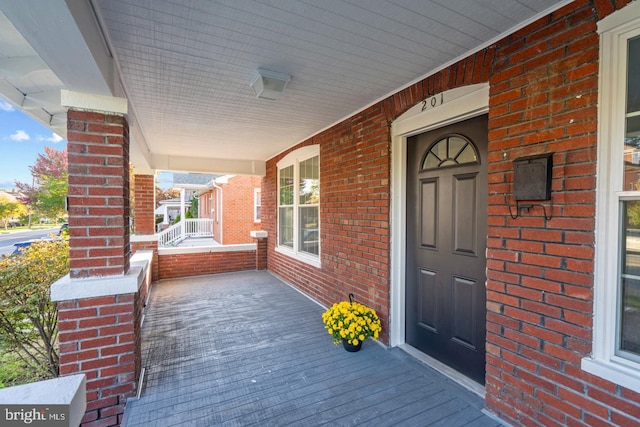 201 Parkway St, Winchester, VA 22601 - view of exterior entry featuring covered porch and brick siding
