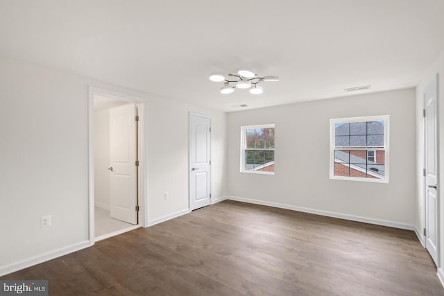 201 Parkway St, Winchester, VA 22601 - unfurnished bedroom featuring a chandelier, dark wood-style floors, and baseboards