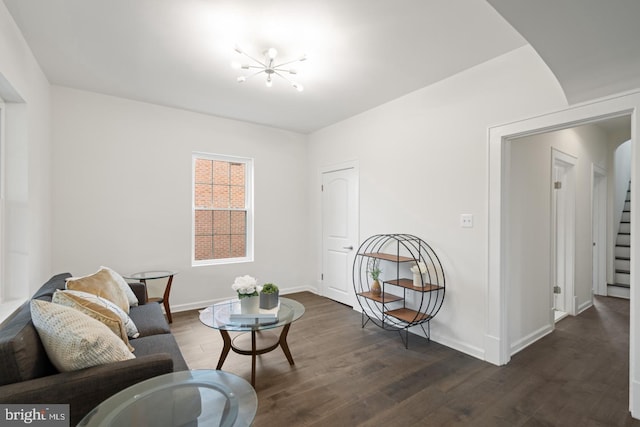 201 Parkway St, Winchester, VA 22601 - living room with dark wood-style floors, a chandelier, and baseboards