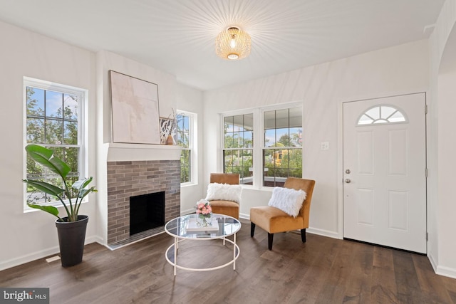 201 Parkway St, Winchester, VA 22601 - entryway with plenty of natural light, dark wood finished floors, and a brick fireplace
