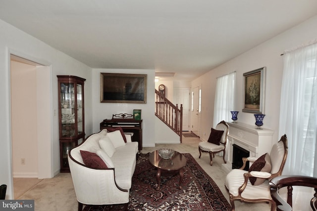 4 W Woodduck Dr, Tuckerton, NJ 08087 - living room with stairs, light carpet, and a fireplace