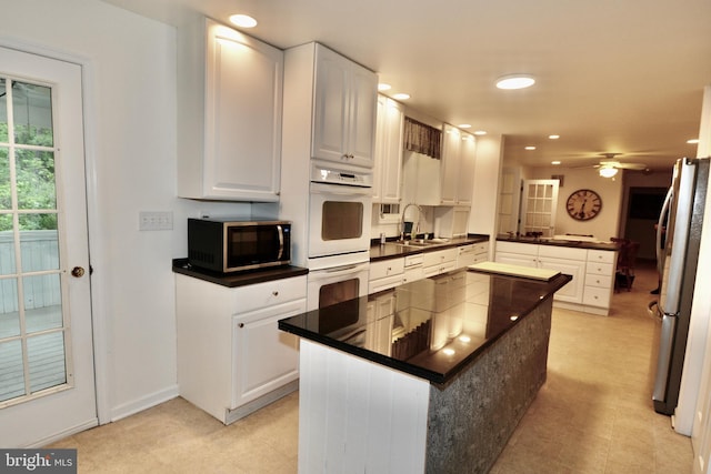 4 W Woodduck Dr, Tuckerton, NJ 08087 - kitchen featuring double oven, dark countertops, freestanding refrigerator, and recessed lighting