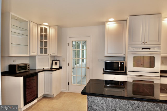 4 W Woodduck Dr, Tuckerton, NJ 08087 - kitchen with wine cooler, stainless steel microwave, double oven, white cabinets, and recessed lighting