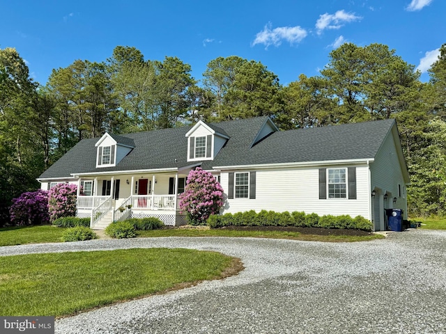 4 W Woodduck Dr, Tuckerton, NJ 08087 - cape cod-style house featuring curved driveway, covered porch, a front lawn, and roof with shingles