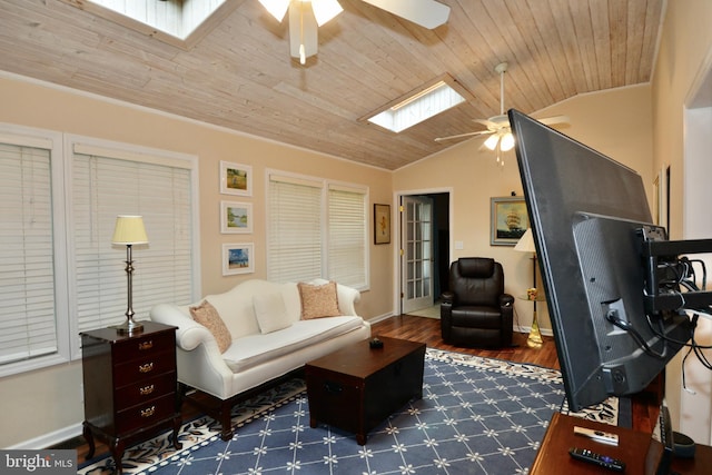 4 W Woodduck Dr, Tuckerton, NJ 08087 - living area featuring a ceiling fan, lofted ceiling, a skylight, wood finished floors, and baseboards