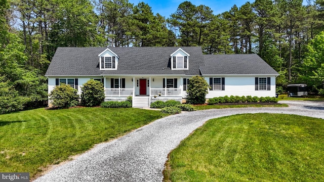 4 W Woodduck Dr, Tuckerton, NJ 08087 - cape cod-style house featuring a porch, curved driveway, a front yard, and a shingled roof