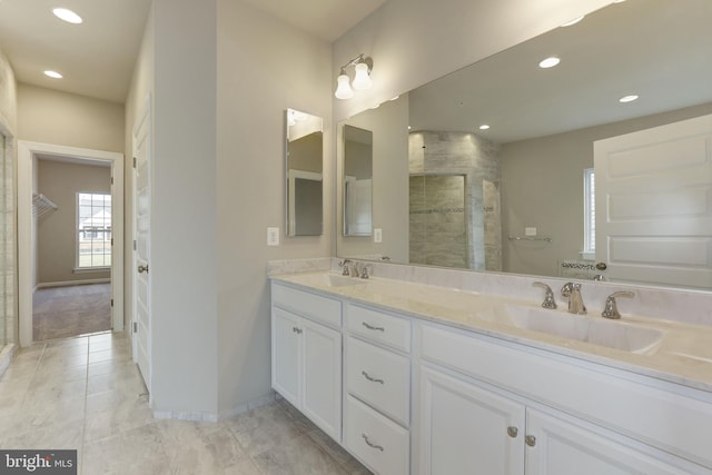 11701 Moriarty Ct, Bowie, MD 20720 - bathroom with double vanity, a tile shower, recessed lighting, and tile patterned flooring