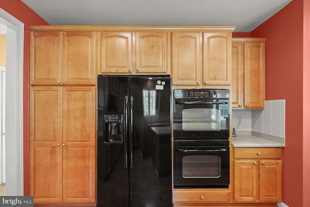 14014 Mary Bowie Pkwy, Upper Marlboro, MD 20774 - kitchen with black appliances, light countertops, and backsplash