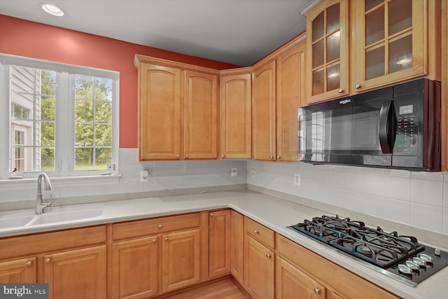 14014 Mary Bowie Pkwy, Upper Marlboro, MD 20774 - kitchen featuring black microwave, gas cooktop, glass insert cabinets, tasteful backsplash, and recessed lighting