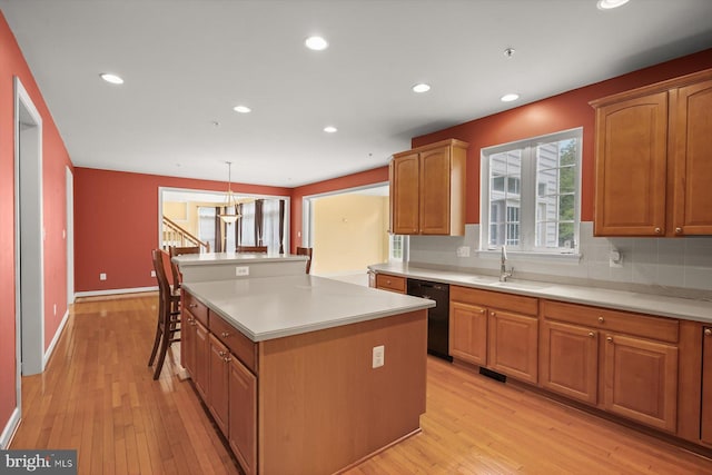 14014 Mary Bowie Pkwy, Upper Marlboro, MD 20774 - kitchen featuring black dishwasher, a kitchen island, light wood-style flooring, light countertops, and recessed lighting