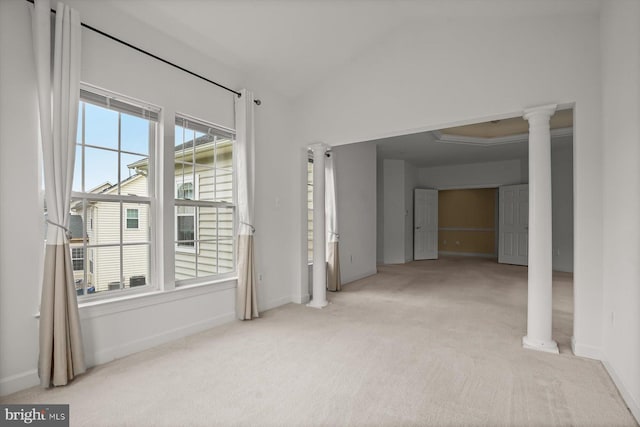 14014 Mary Bowie Pkwy, Upper Marlboro, MD 20774 - carpeted empty room with decorative columns and vaulted ceiling