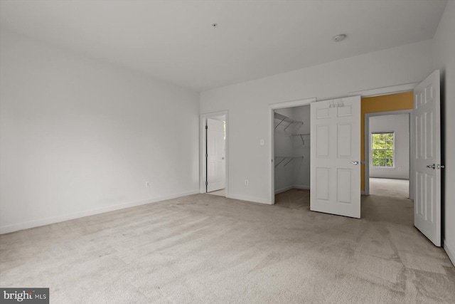 14014 Mary Bowie Pkwy, Upper Marlboro, MD 20774 - unfurnished bedroom with light colored carpet, a spacious closet, and a closet