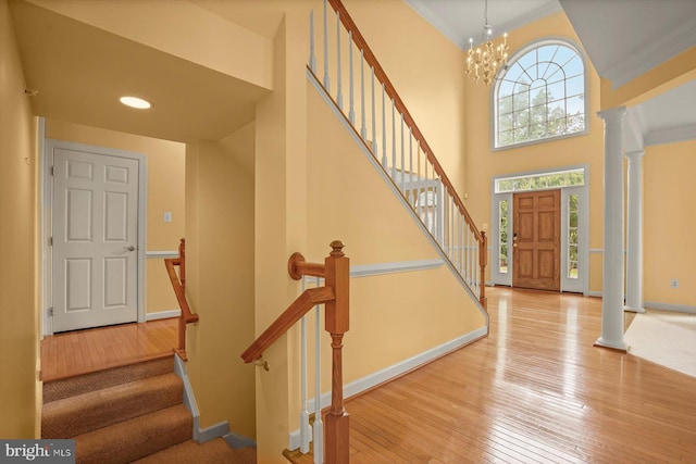 14014 Mary Bowie Pkwy, Upper Marlboro, MD 20774 - foyer entrance with hardwood / wood-style flooring, stairway, a chandelier, a high ceiling, and crown molding