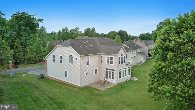 14014 Mary Bowie Pkwy, Upper Marlboro, MD 20774 - back of property featuring entry steps, a yard, a patio area, and roof with shingles