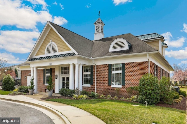 14014 Mary Bowie Pkwy, Upper Marlboro, MD 20774 - view of front of house with brick siding, a standing seam roof, and a front yard
