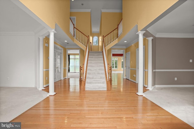 14014 Mary Bowie Pkwy, Upper Marlboro, MD 20774 - entryway with french doors, ornamental molding, stairs, and ornate columns