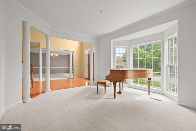 14014 Mary Bowie Pkwy, Upper Marlboro, MD 20774 - sitting room with carpet floors, ornamental molding, a chandelier, and ornate columns
