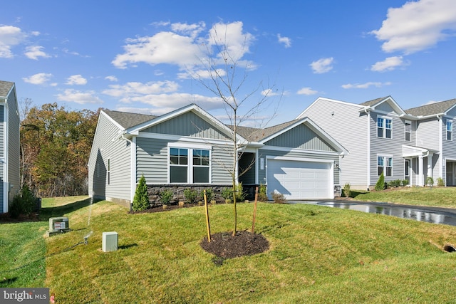 163 Angus Rd, Charles Town, WV 25414 - view of front facade with a garage, asphalt driveway, a front yard, and board and batten siding