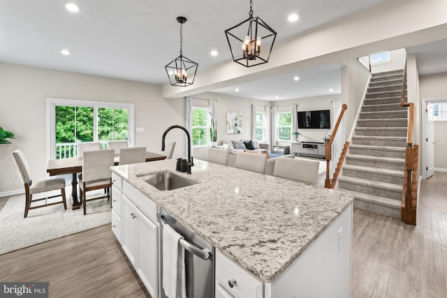 57 Oak Ln, Carneys Point, NJ 08069 - kitchen with stainless steel dishwasher, light wood-style flooring, white cabinetry, recessed lighting, and an island with sink