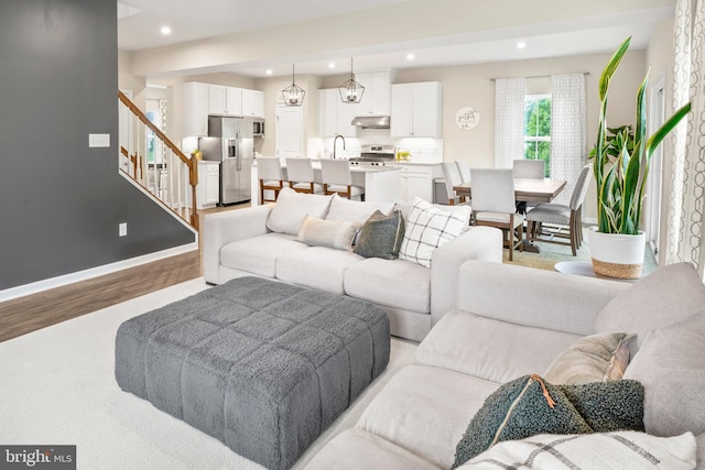 57 Oak Ln, Carneys Point, NJ 08069 - living area with light wood-type flooring, stairs, and recessed lighting